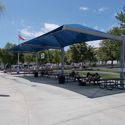 Shade structures like canopies, in public environments, providing shade and UV protection.